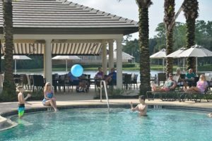 Families enjoying the pools at Plantation Bay